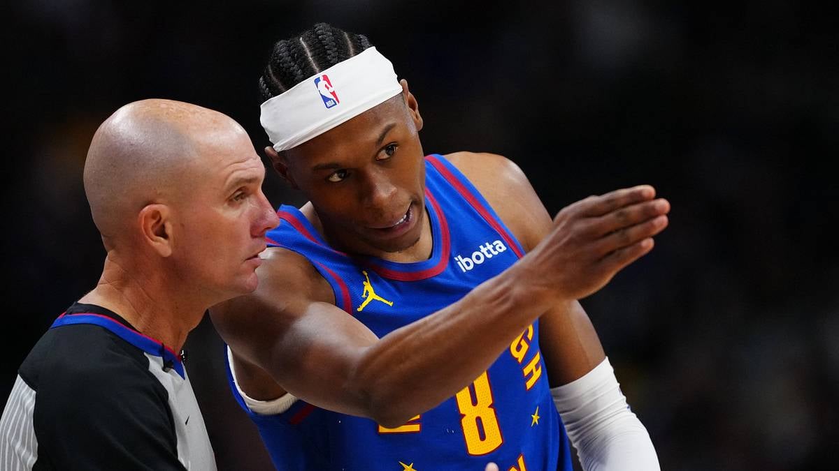 Peyton Watson of the Denver Nuggets in discussion during an NBA game