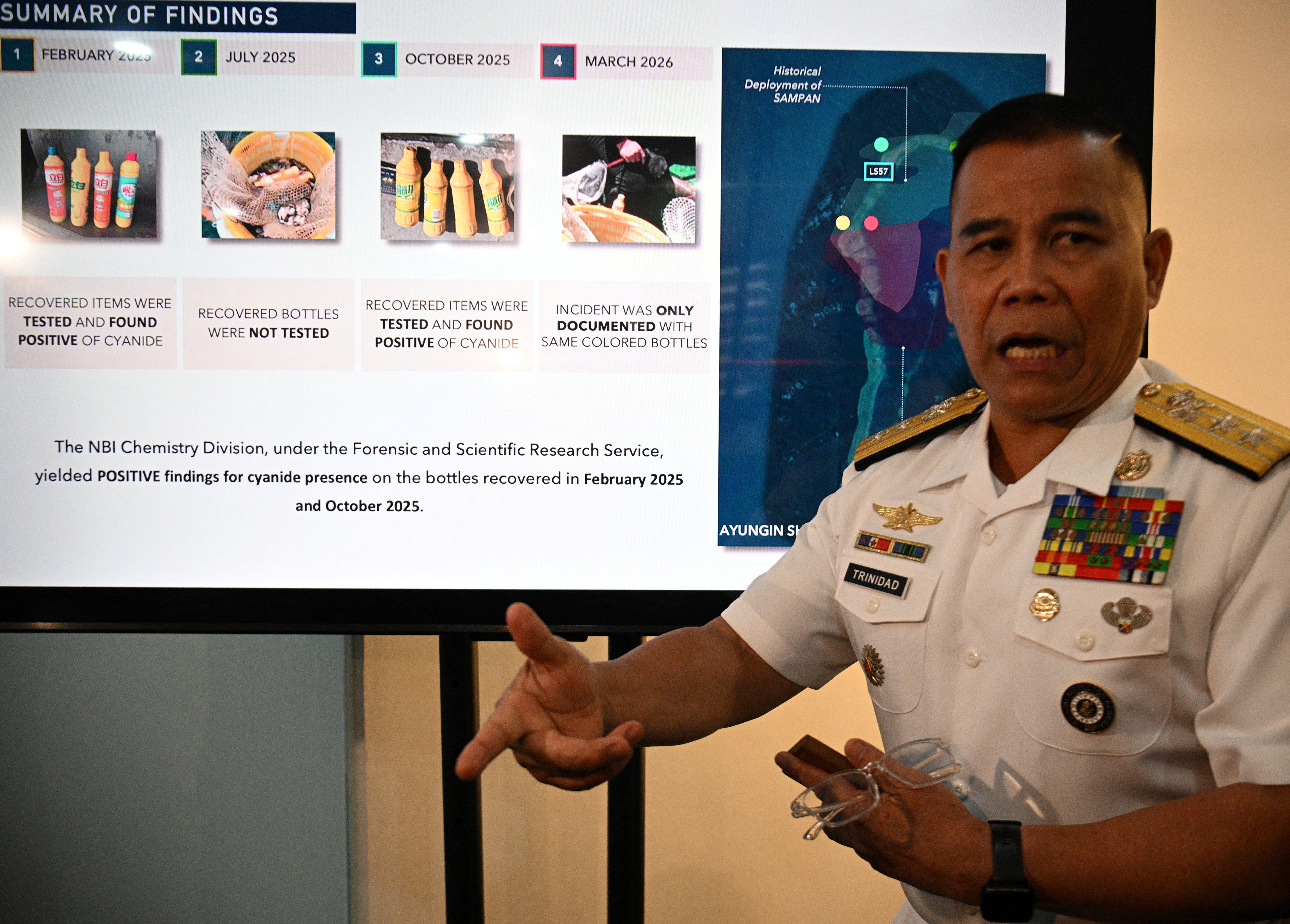 Philippine Navy spokesman presents seized bottles suspected to contain cyanide allegedly used by China in the South China Sea