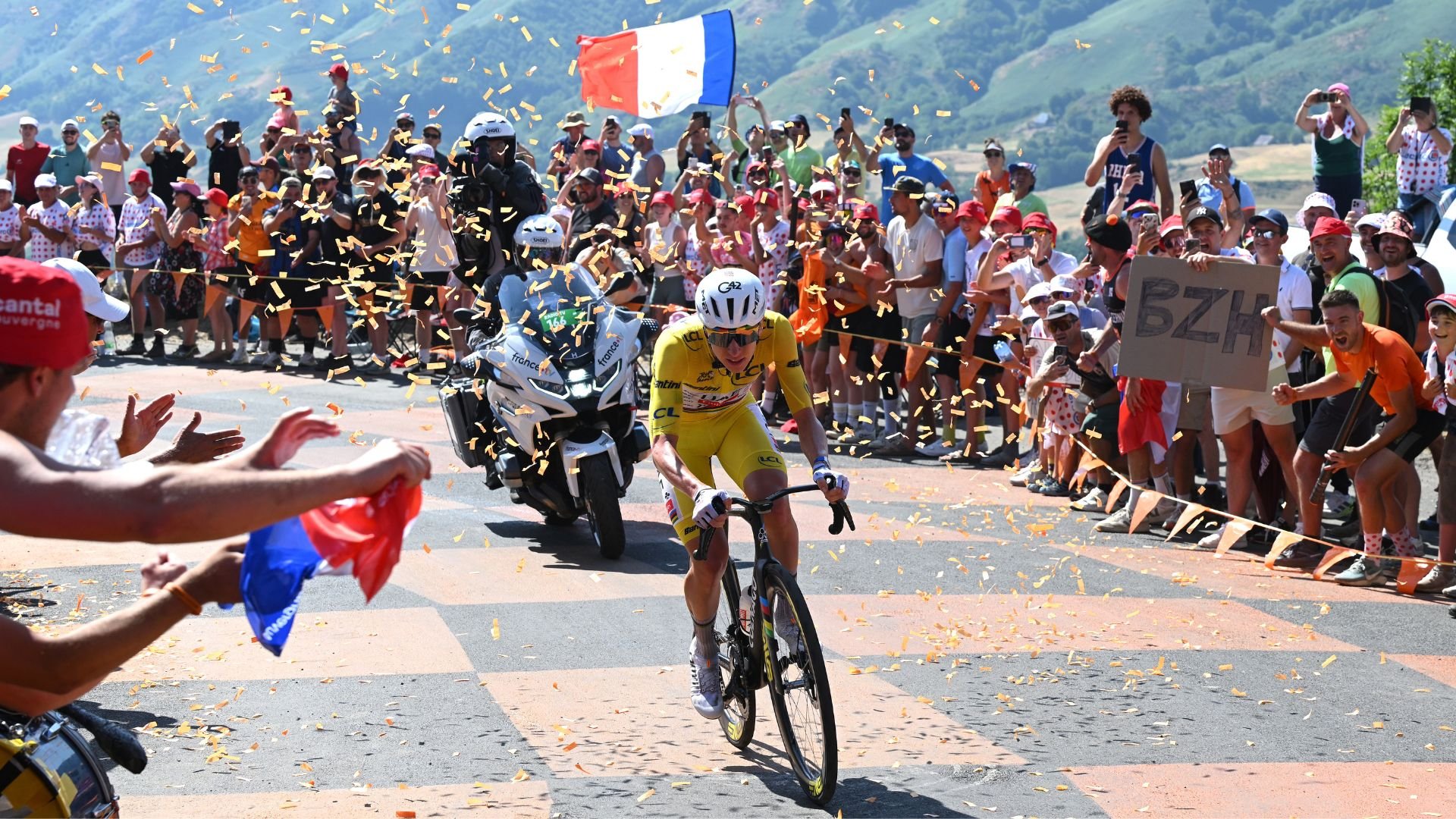 Tadej Pogacar crosses the finish line at Le Lioran on Bastille Day to win Stage 10 of the 2026 Tour de France