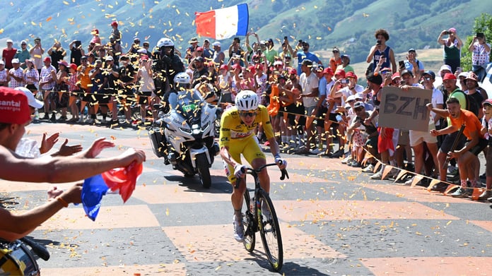 Tadej Pogacar crosses the finish line at Le Lioran on Bastille Day to win Stage 10 of the 2026 Tour de France