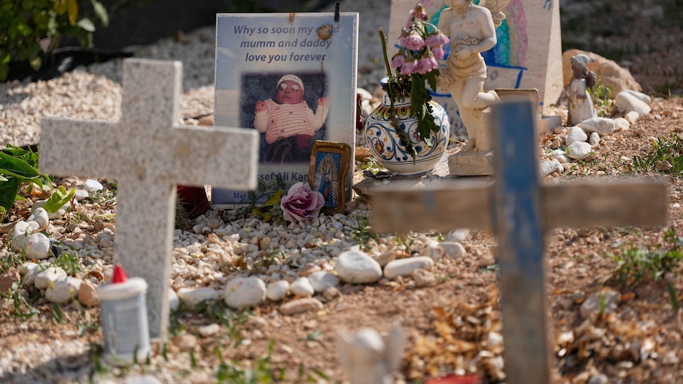 Pope Leo XIV visits the migrant cemetery at Lampedusa placing flowers at the graves of shipwreck victims