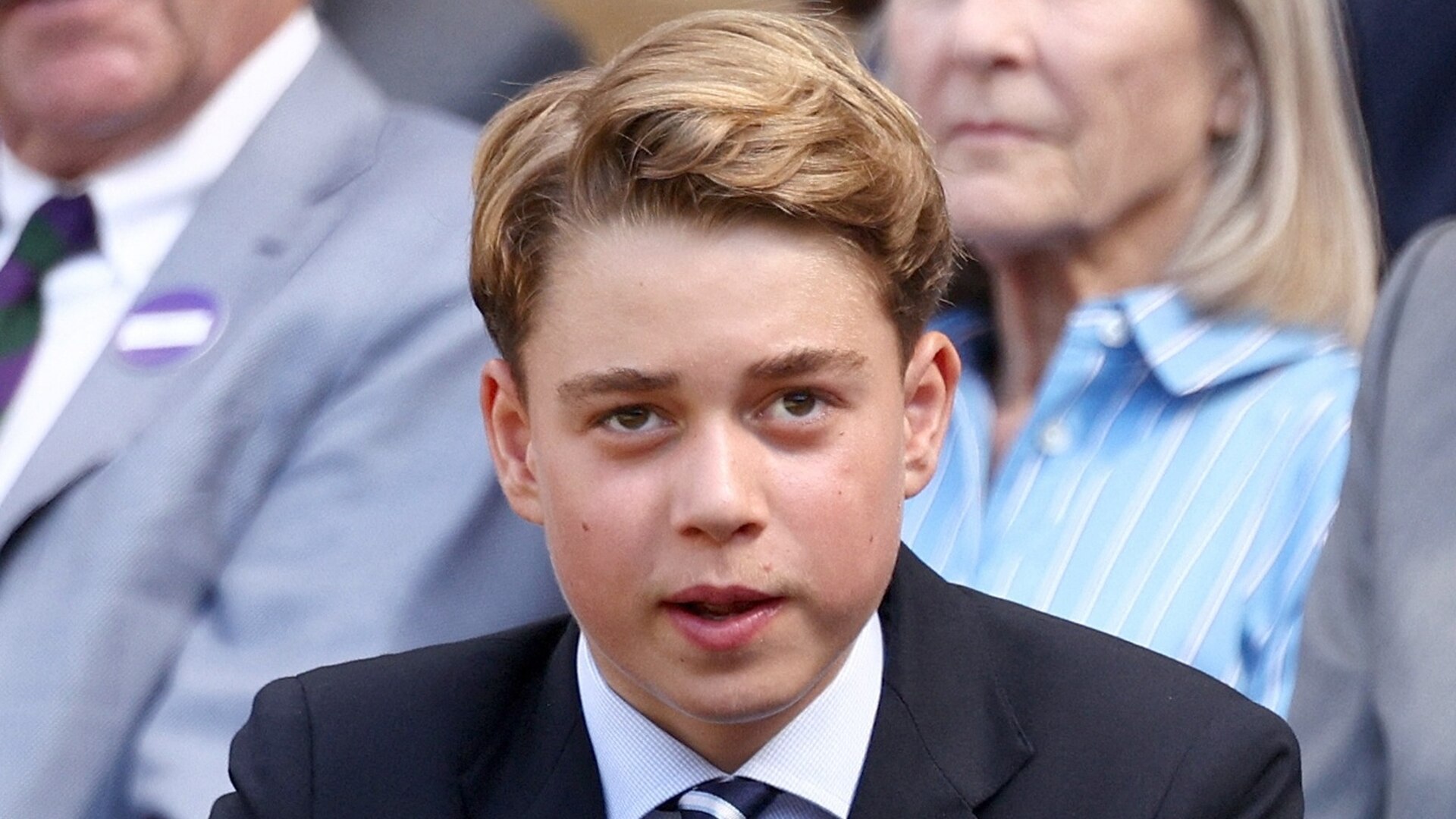 Prince George smiles in a portrait photograph taken at Kensington Palace for his 13th birthday