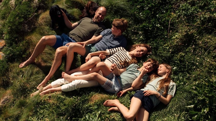 Prince William and Princess Kate with their three children in a summer family photo from their Instagram summer rewind post