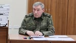 Russian President Vladimir Putin receives a briefing from Chief of the General Staff Valery Gerasimov at an army command centre