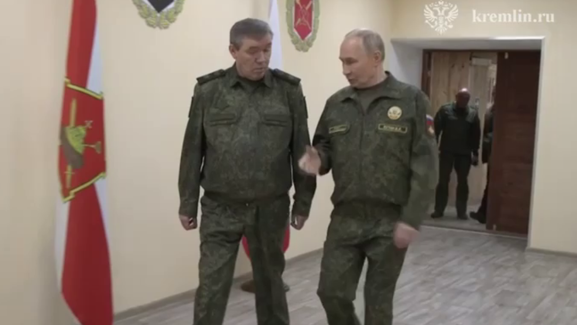 Russian President Vladimir Putin speaks with Chief of the General Staff Valery Gerasimov at a command post during the Russian military operation in Ukraine