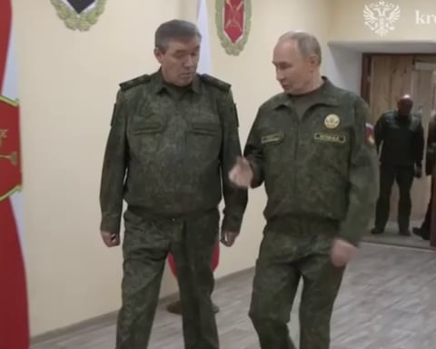 Russian President Vladimir Putin speaks with Chief of the General Staff Valery Gerasimov at a command post during the Russian military operation in Ukraine