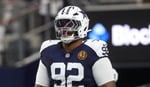 Dallas Cowboys defensive tackle Quinnen Williams warming up before an NFL game at AT&T Stadium