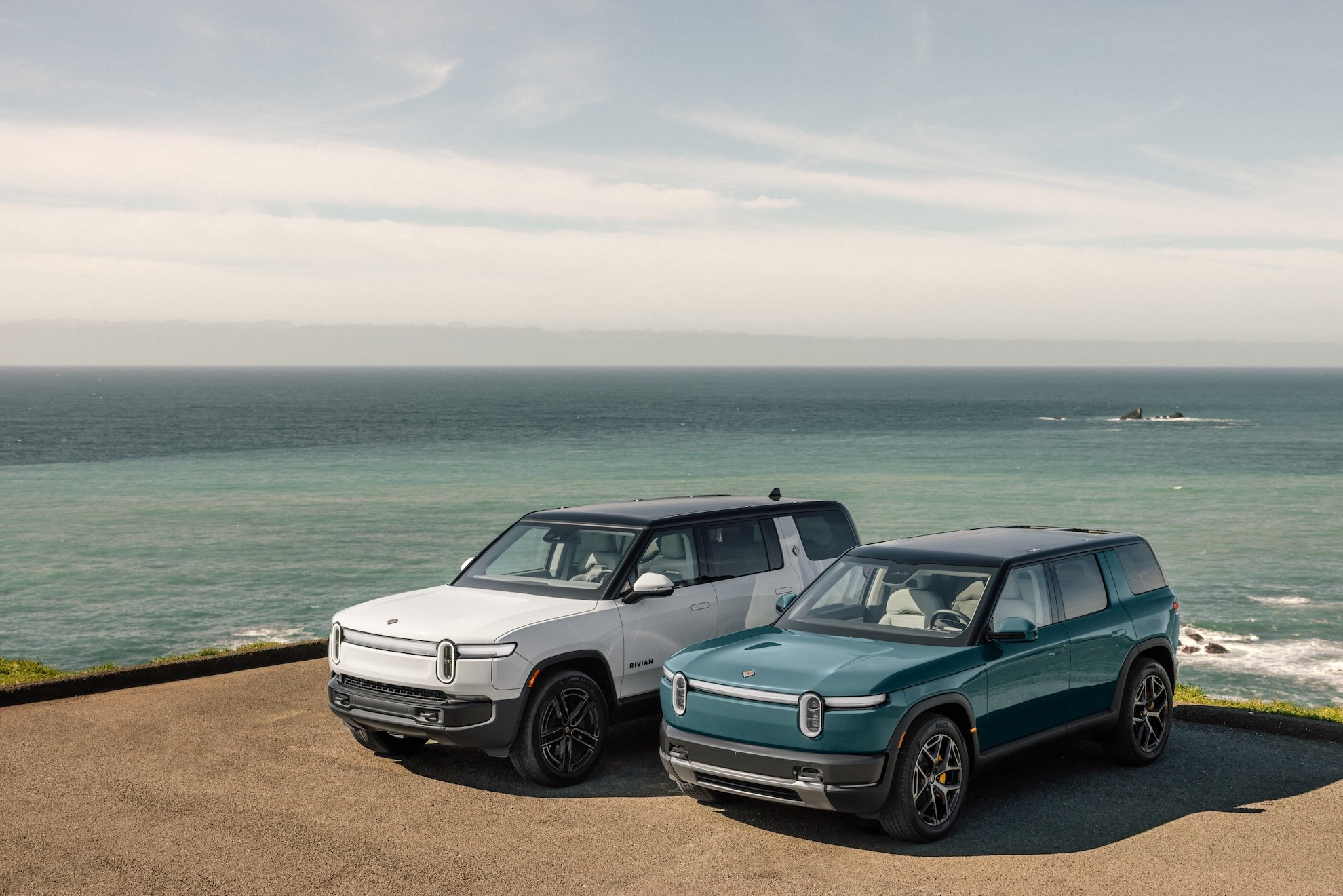 Rivian R1 and R2 electric vehicles parked side by side as Q2 2026 deliveries beat company guidance