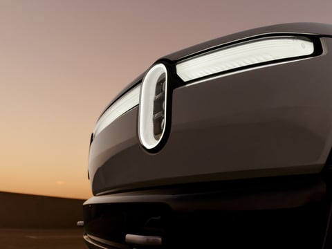 Rivian R2 electric SUV headlight as the company beats Q2 2026 delivery targets and raises guidance