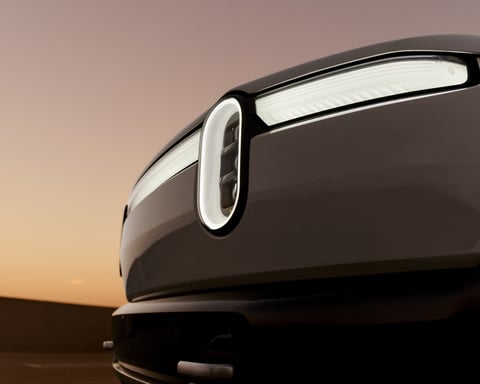 Rivian R2 electric SUV headlight as the company beats Q2 2026 delivery targets and raises guidance