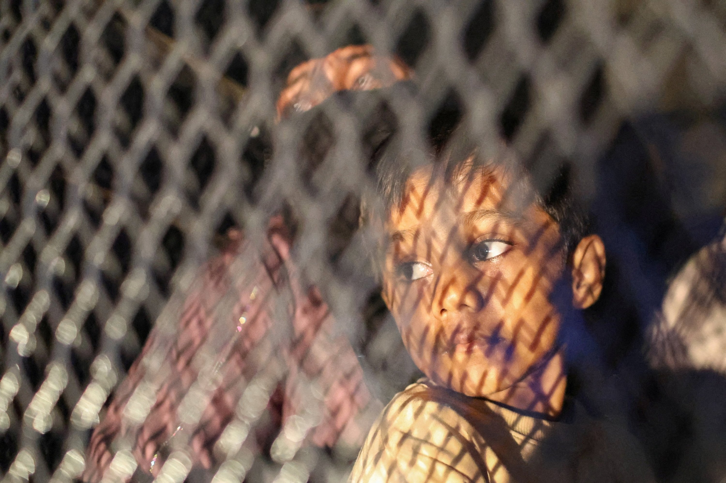 Rohingya refugees gather near UNHCR offices in Malaysia as the government begins screening detainees for repatriation to Myanmar