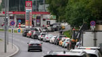 Cars line up at a Lukoil gas station in Moscow during Russia's fuel rationing crisis