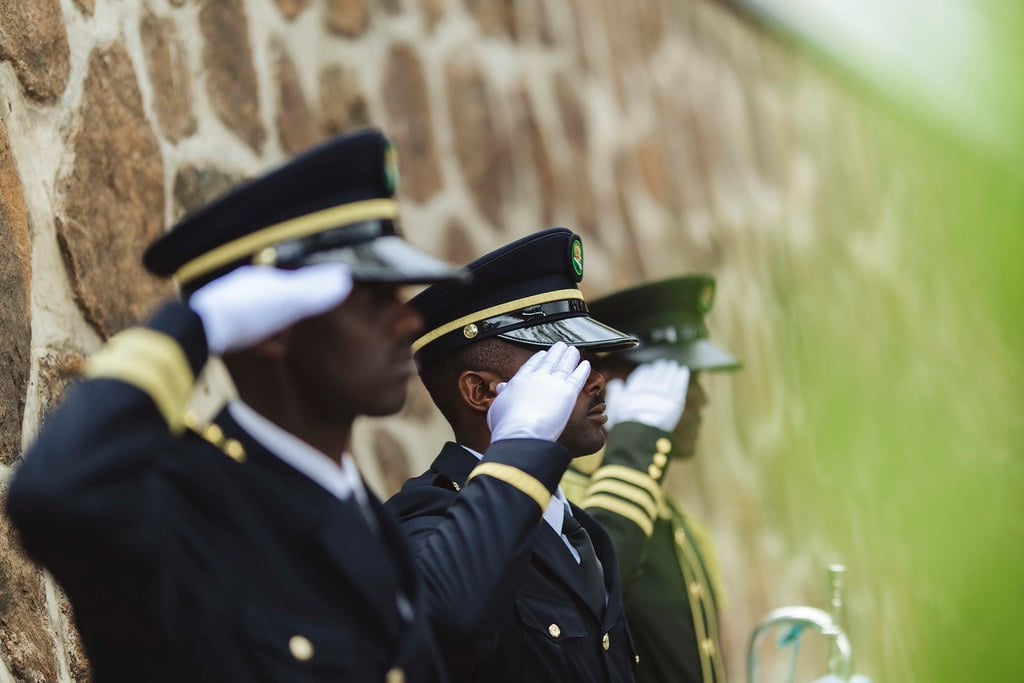 Uniformed Rwandan personnel saluting during genocide commemoration ceremony marking 32 years since 1994 genocide