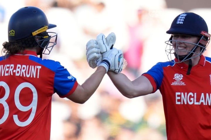 Nat Sciver-Brunt and Heather Knight celebrate during their record 133-run partnership in the Women's T20 World Cup semifinal at The Oval