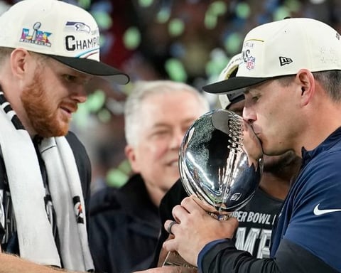 Seattle Seahawks players on the field representing the franchise sold to Vinod Khosla for a record 9.6 billion dollars