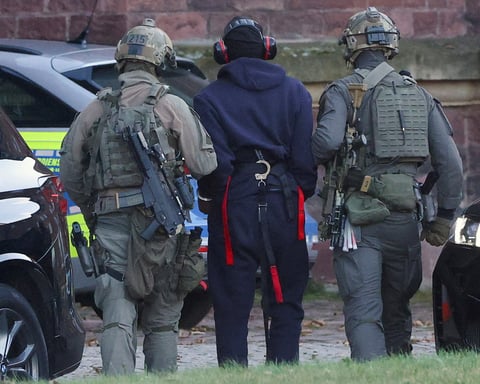 Police escort Nord Stream suspect Serhii Kuznietsov from helicopter before hearing with German Federal Public Prosecutor in Karlsruhe, November 2025