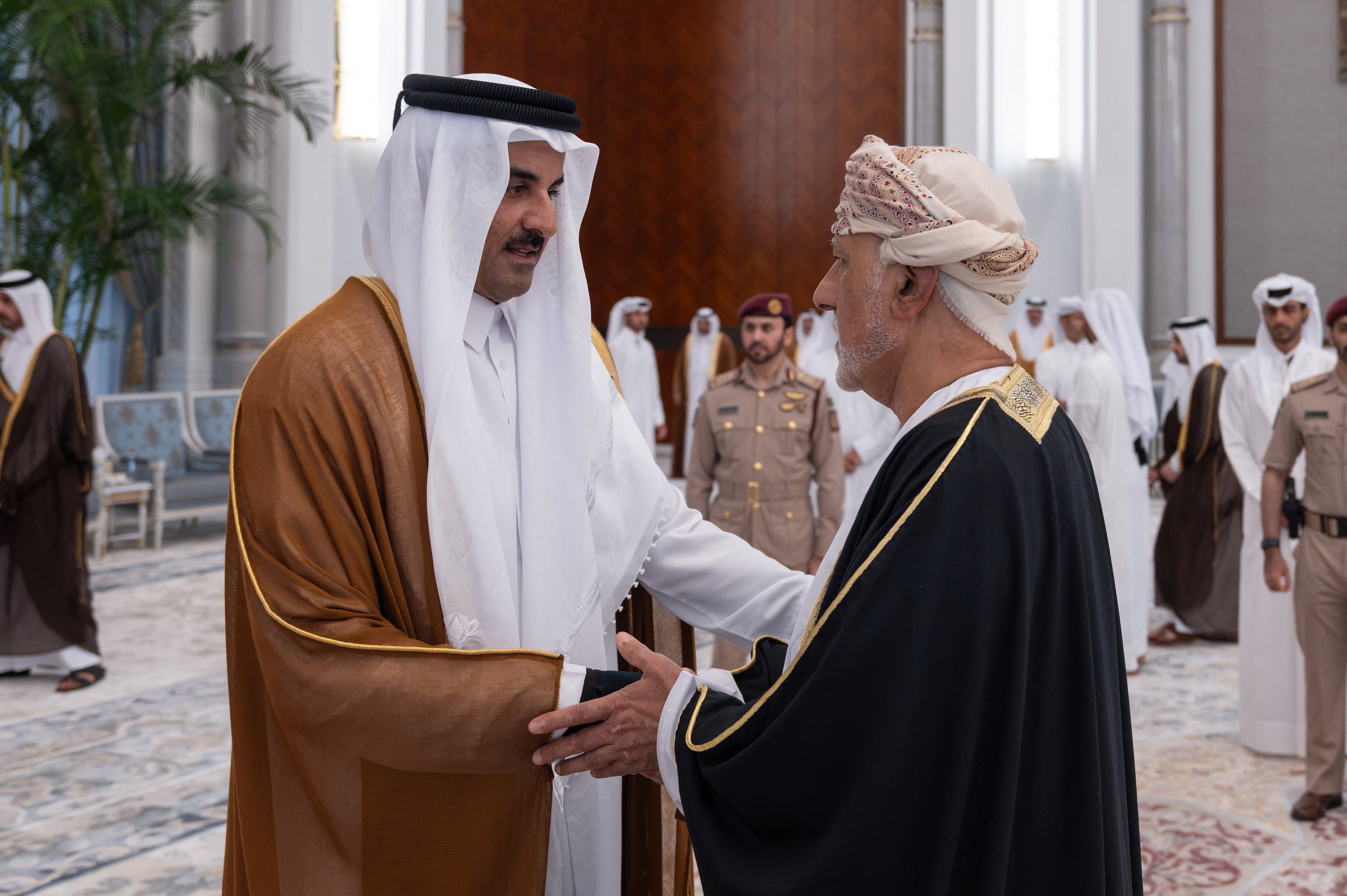 Qatar's Emir Sheikh Tamim bin Hamad Al Thani receives condolences from Oman's Deputy Prime Minister at Lusail Palace