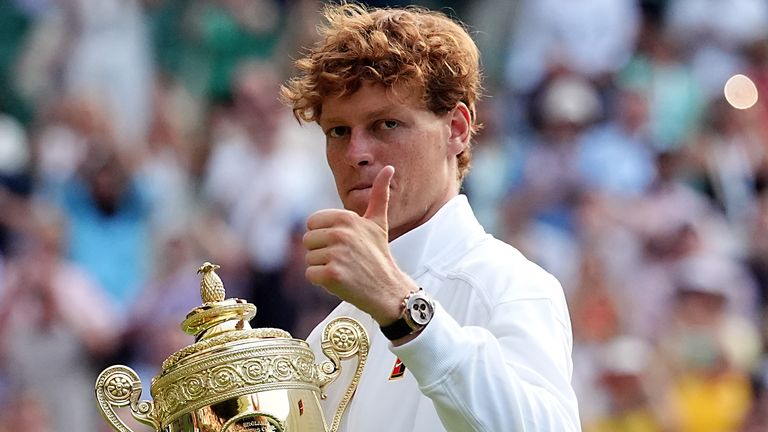 Jannik Sinner defending champion Wimbledon 2026 with trophy from 2025 final at SW19
