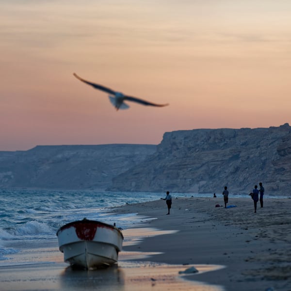 Fishermen on the beach at dusk in Eyl, Puntland, Somalia, the historic base of Somali pirate operations
