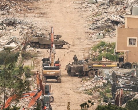 Israeli military equipment amid destroyed buildings in Mais al-Jabal village southern Lebanon April 2026
