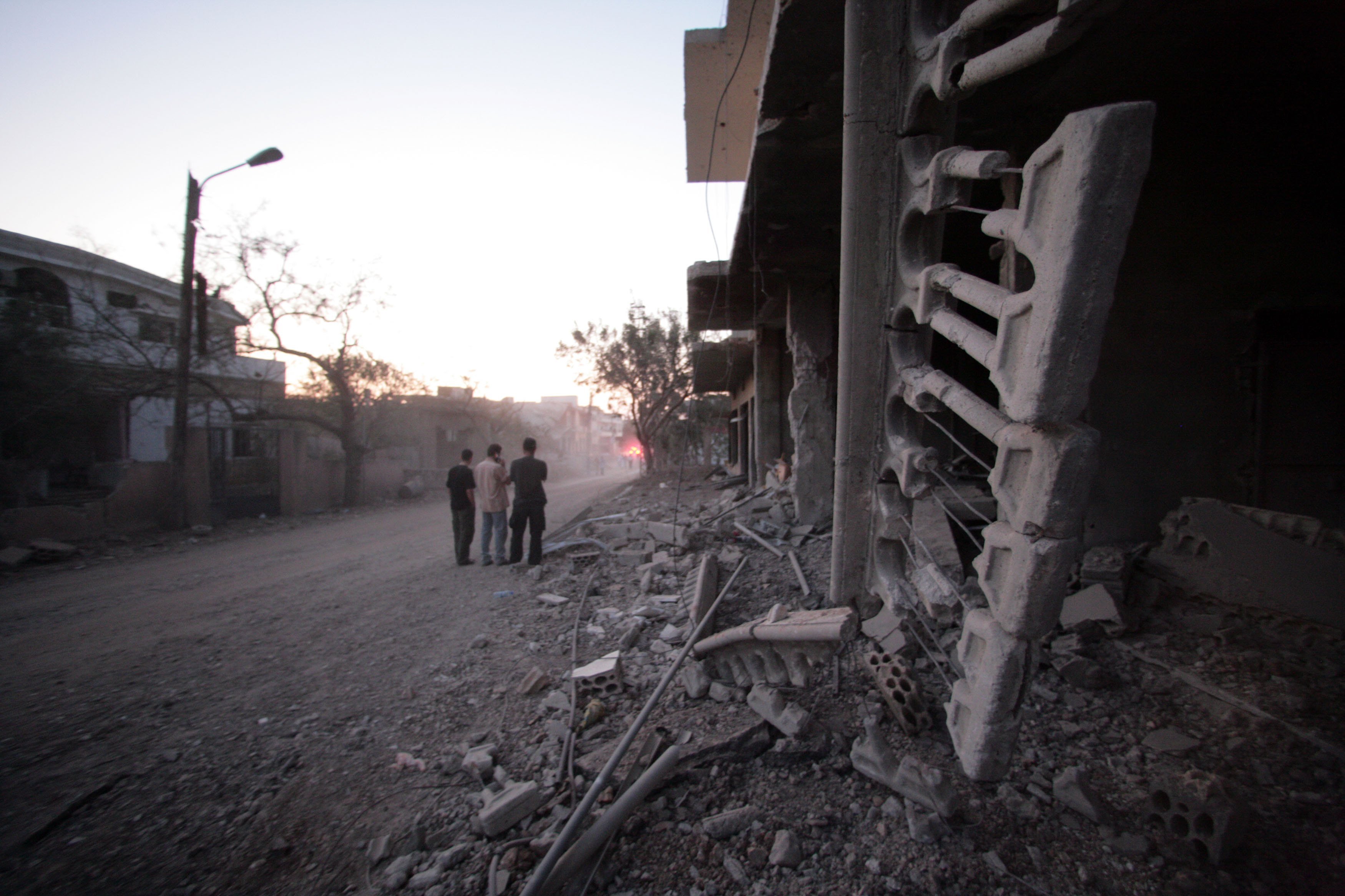Destroyed buildings in southern Lebanon following Israeli military operations, with rubble and damaged structures visible