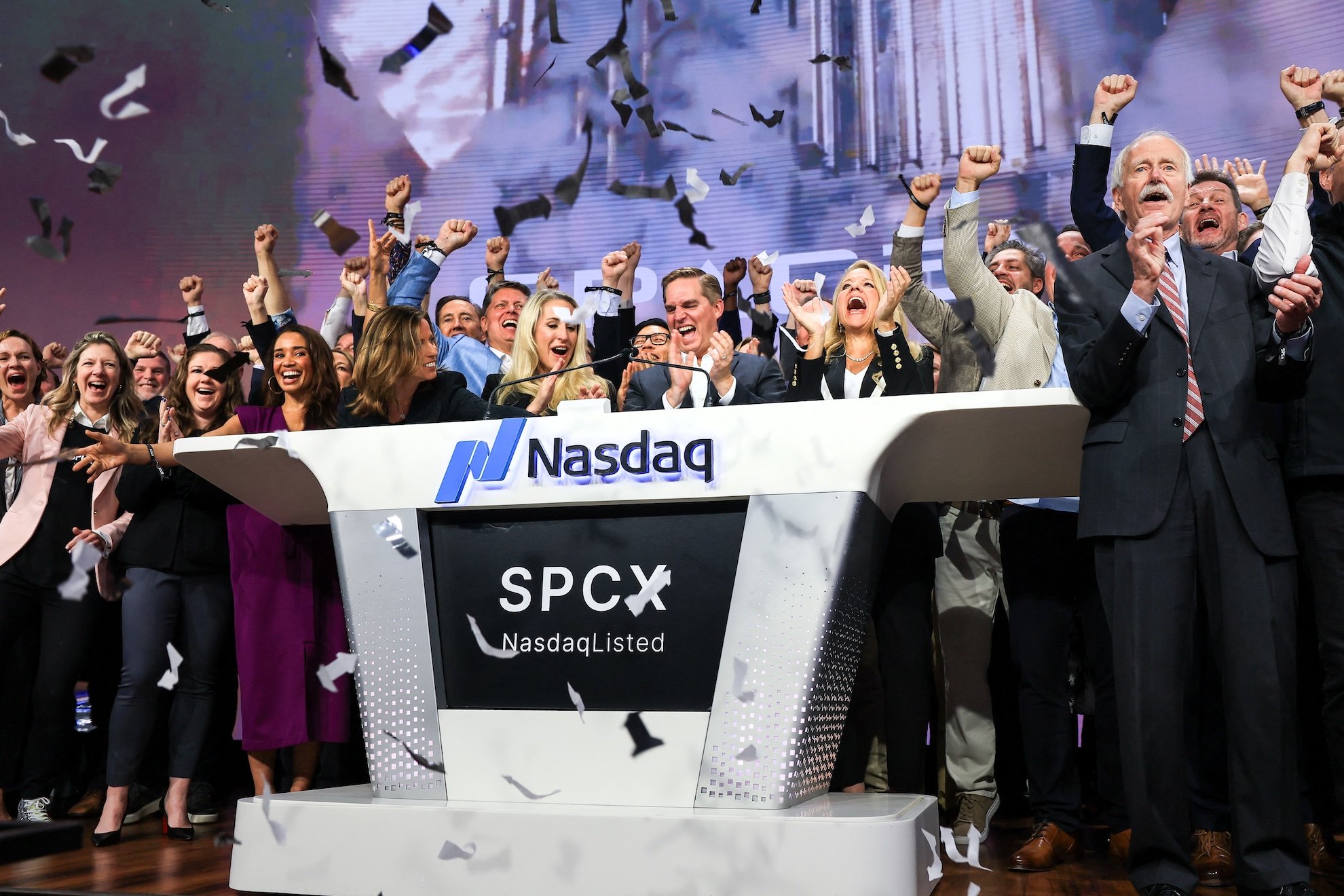SpaceX CFO Bret Johnsen and President Gwynne Shotwell ring the opening bell at the Nasdaq in June 2026 to mark the company IPO