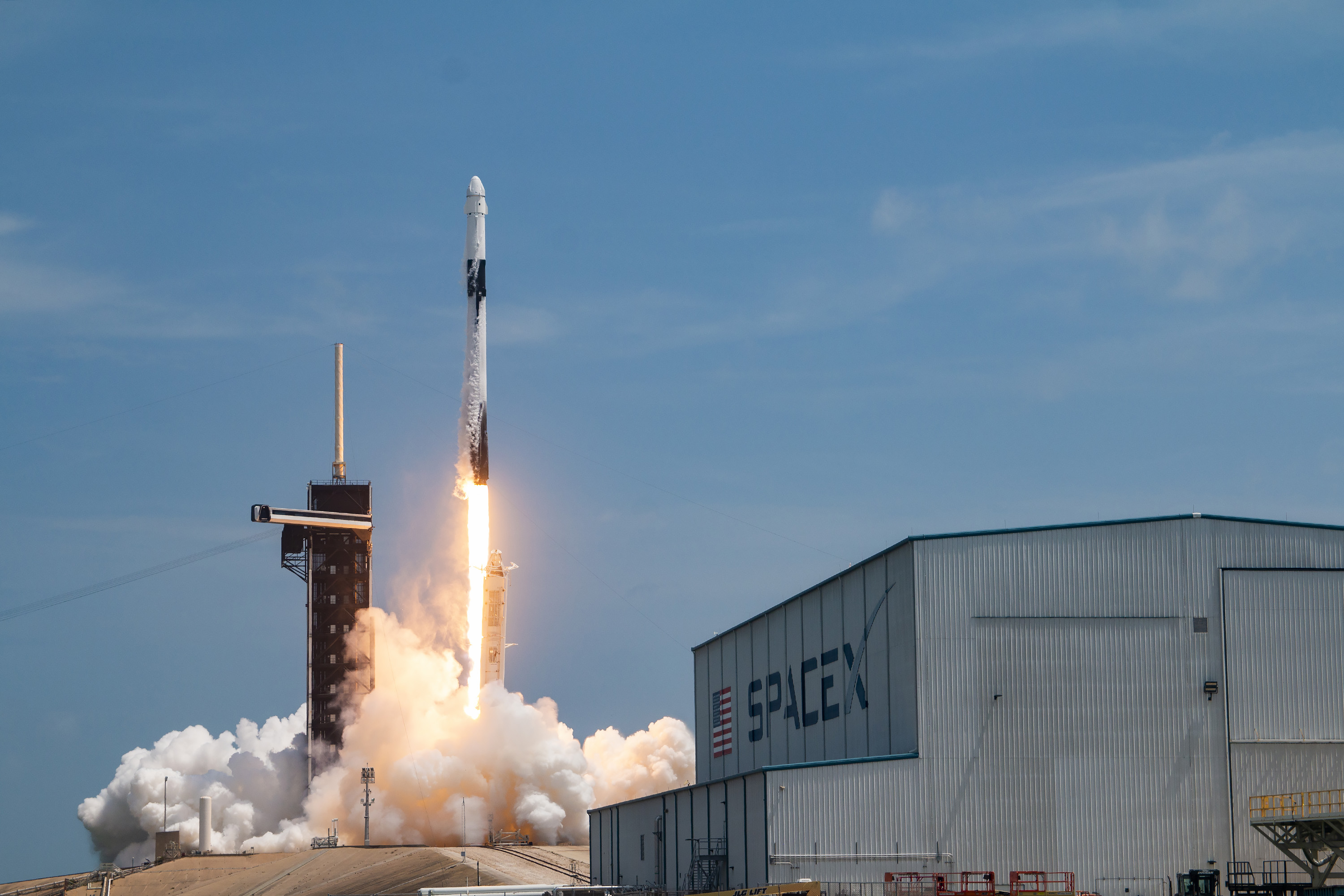 A SpaceX Falcon 9 rocket lifts off from the Florida coast during a cargo resupply mission to the International Space Station