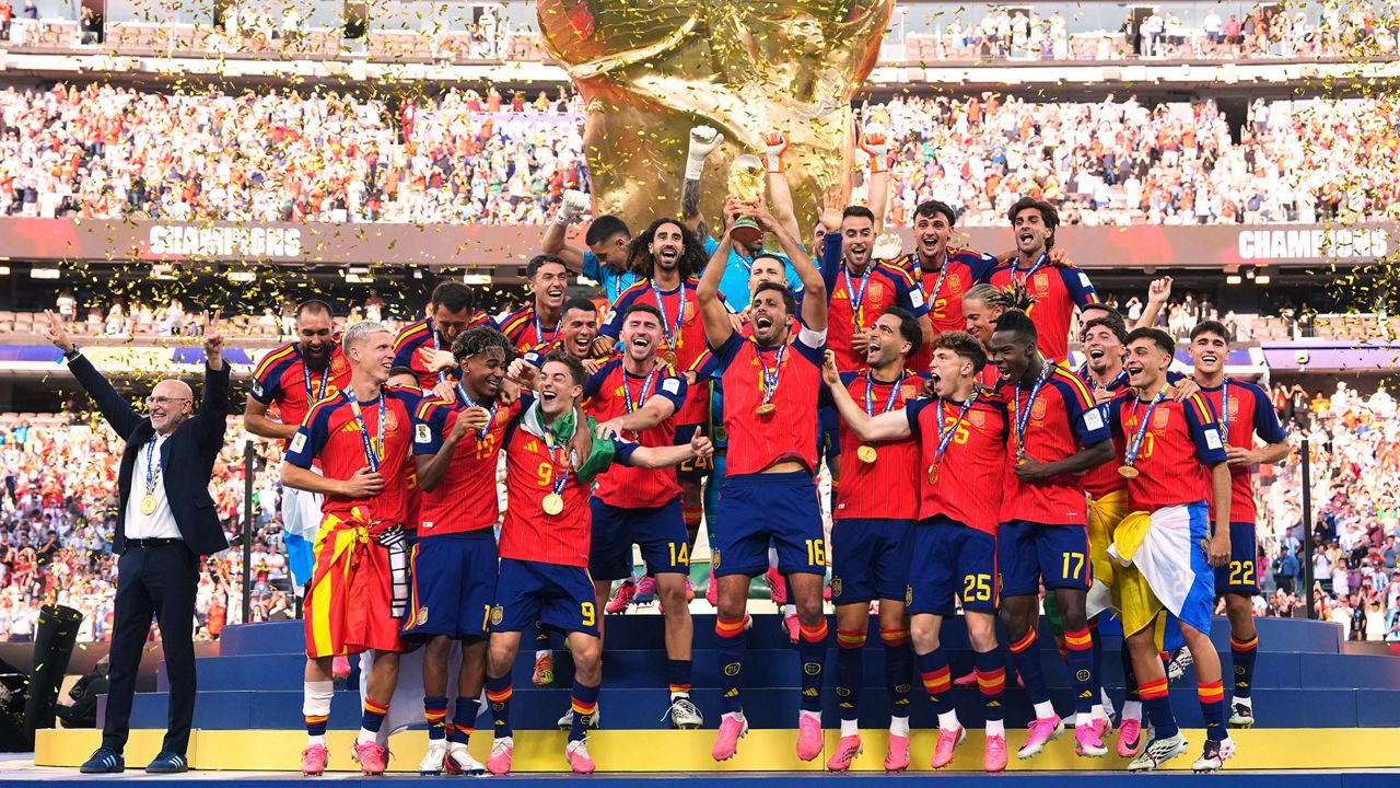 Spain celebrate winning the FIFA World Cup 2026 title, with Cucurella and Rodri among the three Spanish players named in the tournament's best XI