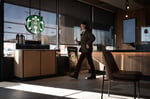 A Starbucks store exterior with the brand's signature green logo as the coffee chain reports fiscal Q3 2026 earnings