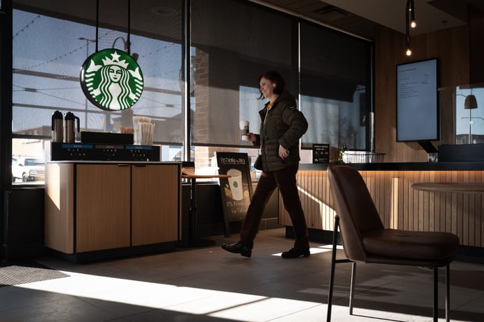 A Starbucks store exterior with the brand's signature green logo as the coffee chain reports fiscal Q3 2026 earnings