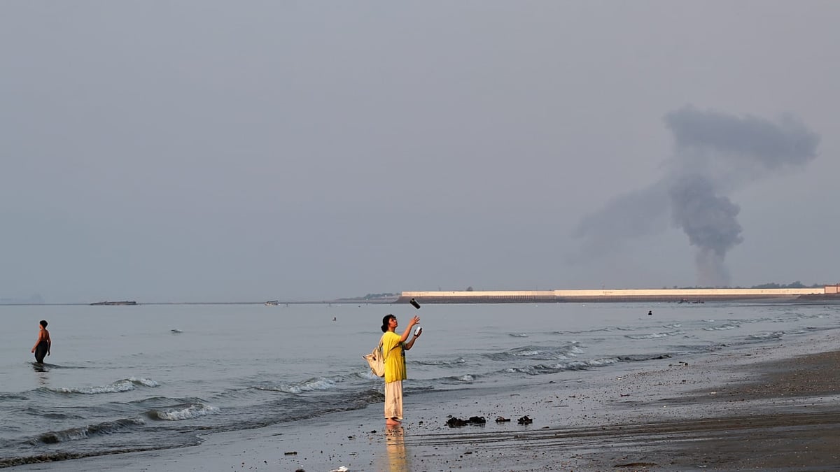 A plume of smoke rises over the Strait of Hormuz following an explosion off Bandar Abbas Iran July 2026