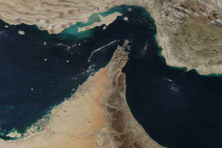 Satellite image of the Strait of Hormuz showing the narrow passage between Iran and Oman during the US-Iran conflict