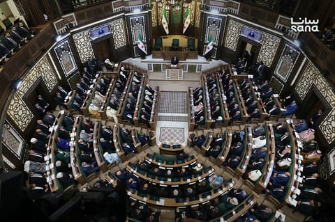 Members of Syria's new People's Assembly attend the inaugural session in Damascus on July 12, 2026