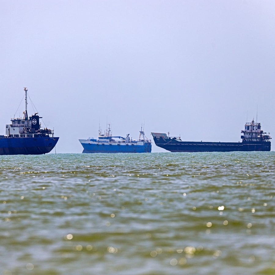 Oil tankers anchored near the Strait of Hormuz as the waterway remains closed during US-Iran conflict
