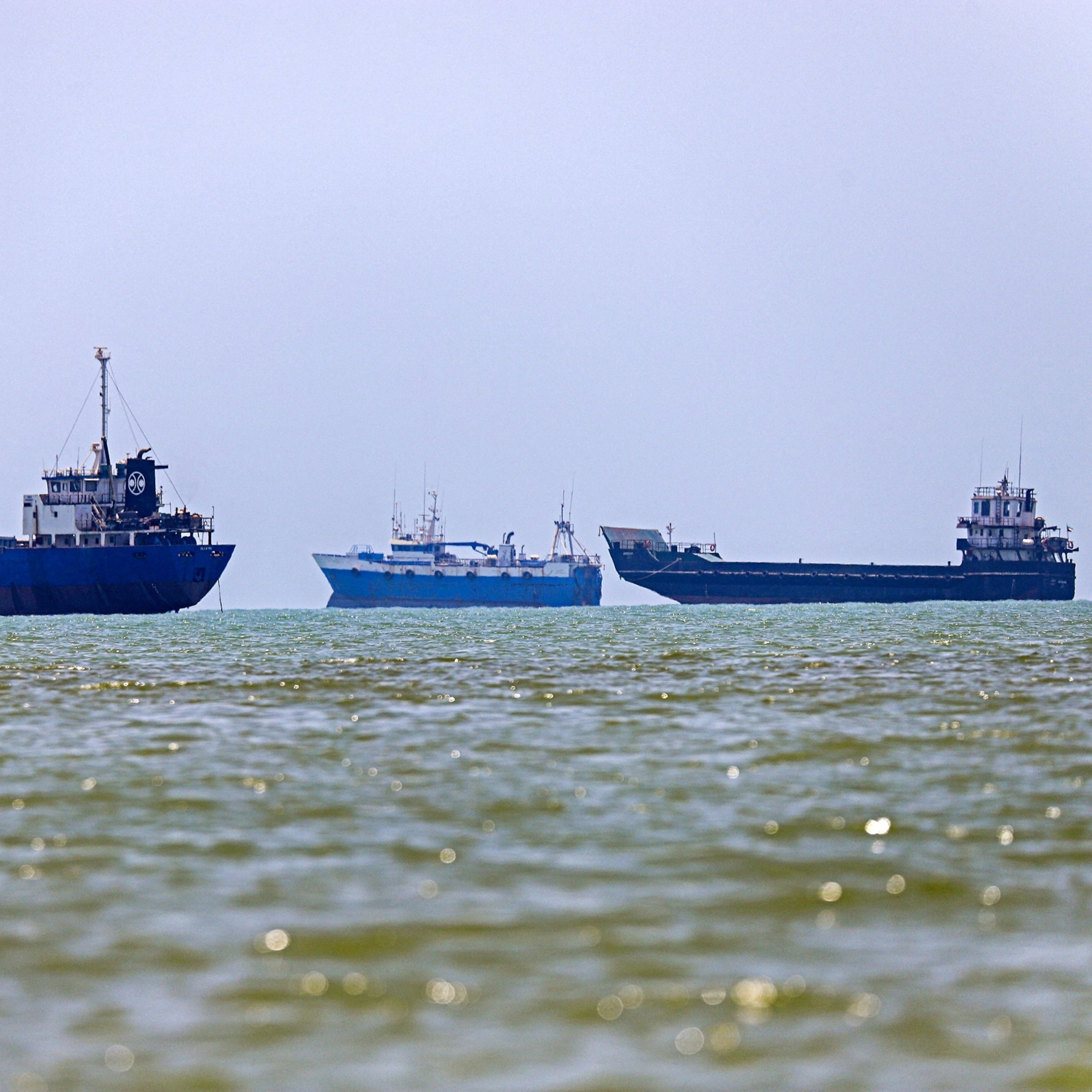 Oil tankers anchored near the Strait of Hormuz as the waterway remains closed during US-Iran conflict