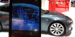 Tesla vehicle cutaway illustration as company imposes $200 per week AI tool spending cap exempting Grok from Elon Musk's xAI
