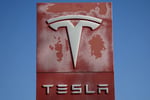 Tesla dealership logo as the company reports record Q2 2026 deliveries of 480000 vehicles and misses earnings estimates