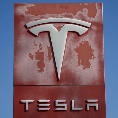 Tesla dealership logo as the company reports record Q2 2026 deliveries of 480000 vehicles and misses earnings estimates