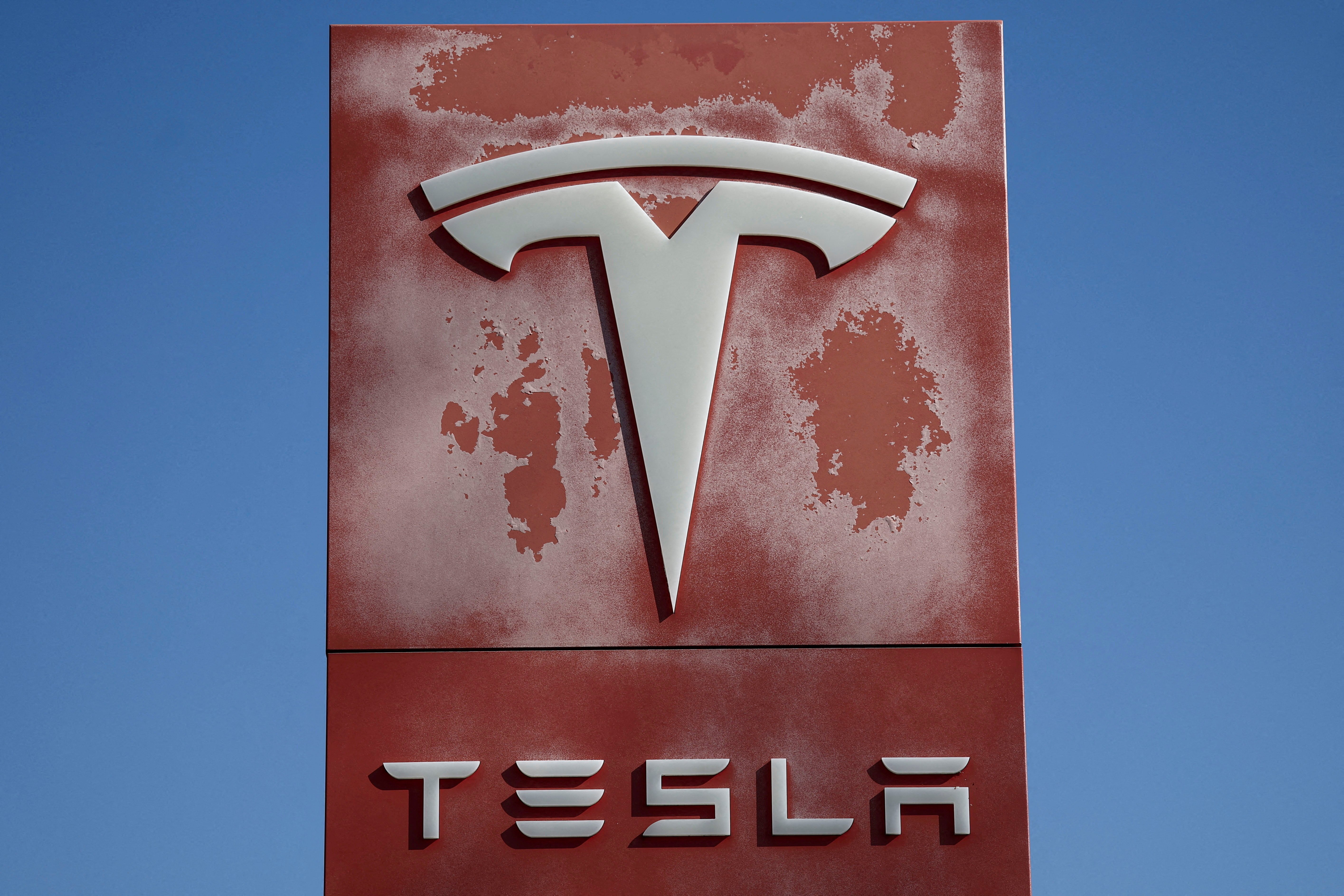Tesla dealership logo as the company reports record Q2 2026 deliveries of 480000 vehicles and misses earnings estimates