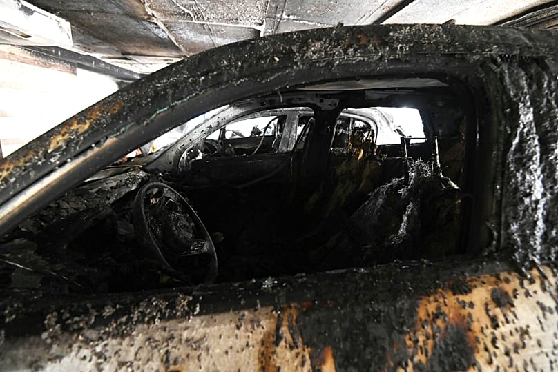 Burned vehicles from firebomb attacks targeting New Democracy politicians in Thessaloniki Greece July 2026