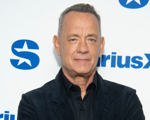 Tom Hanks in a baseball cap at a 2027 film event for The Comebacker