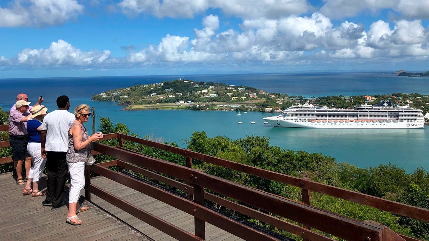 Tourists overlooking Saint Lucia island landscape with travel warning in effect