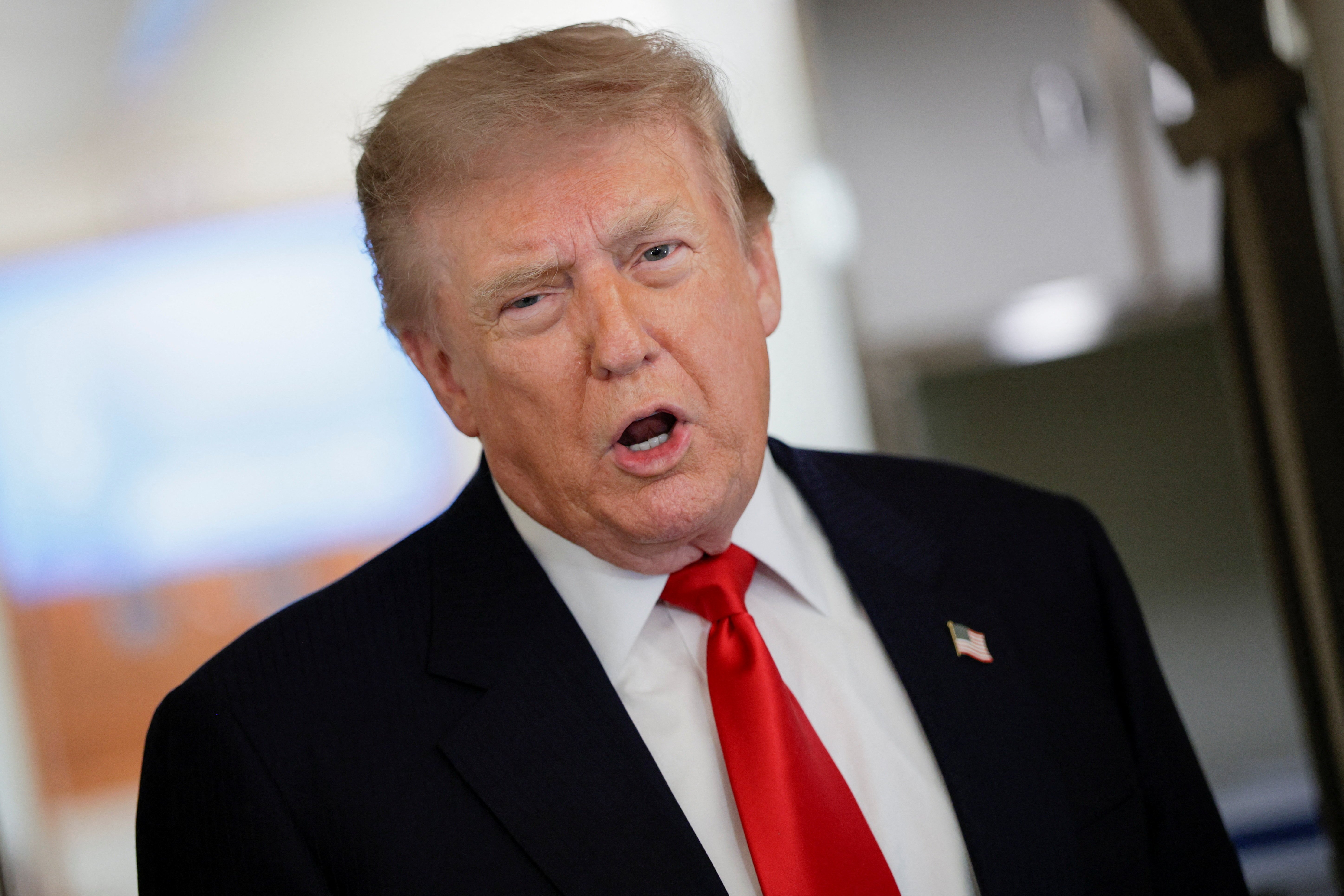 U.S. President Donald Trump speaks to reporters aboard Air Force One on July 27, 2026, amid US-Iran ceasefire negotiations