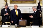 President Donald Trump at a White House crypto event as his 2025 financial disclosure revealed $1.4 billion in cryptocurrency earnings