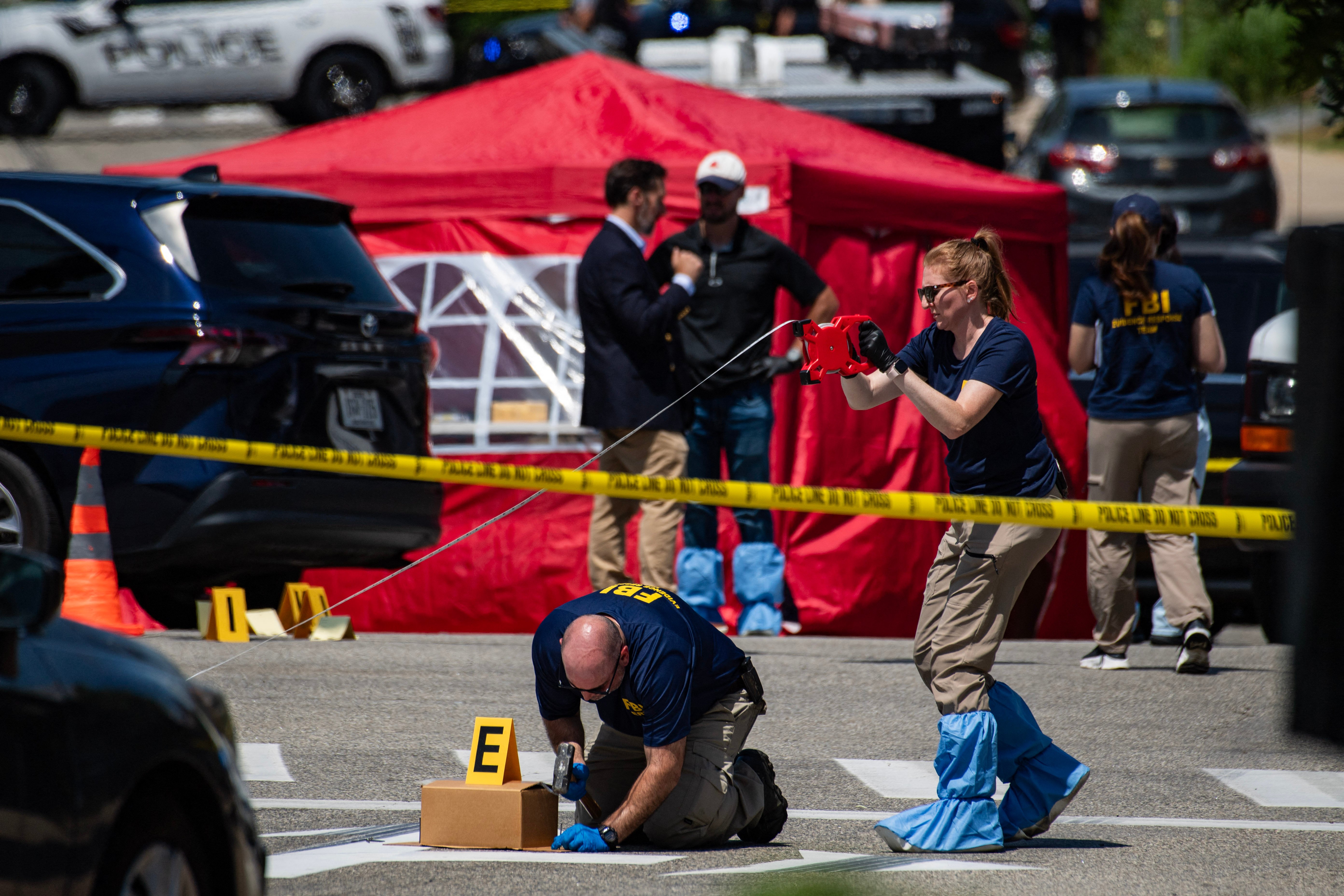 FBI agents investigate the scene of an ICE shooting in Biddeford, Maine