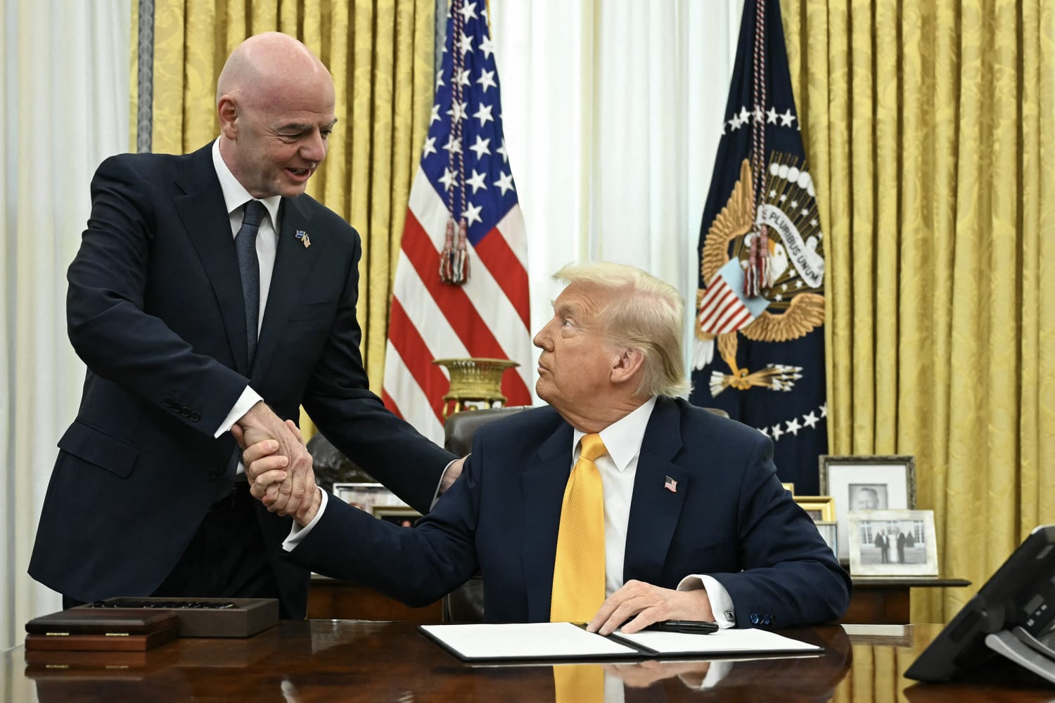 President Trump with FIFA President Gianni Infantino and US soccer player Folarin Balogun at the White House