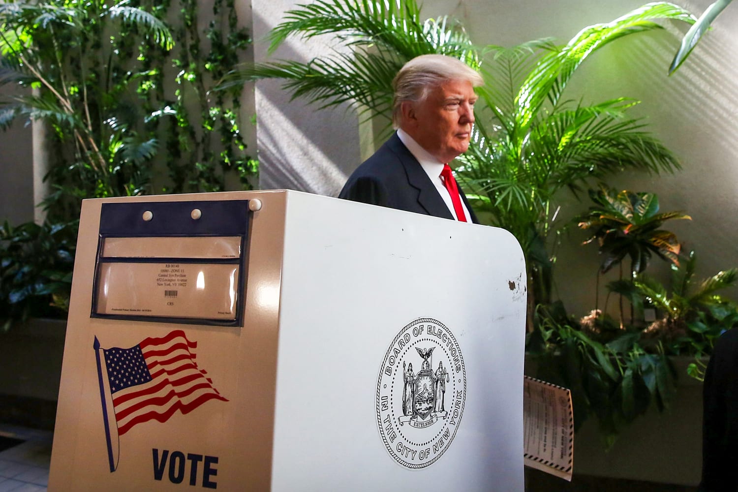 Donald Trump at a voting location as DC Circuit reinstates USPS mail-in voting rule in 2026