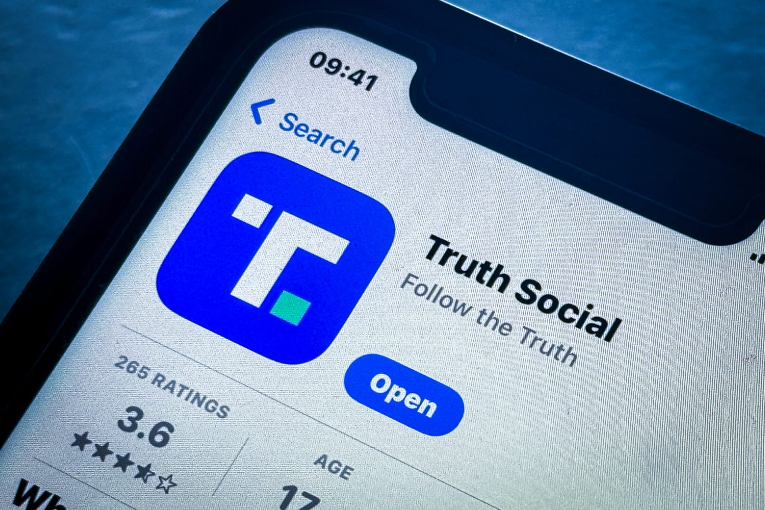 Trump Media Truth Social app logo on smartphone DJT stock