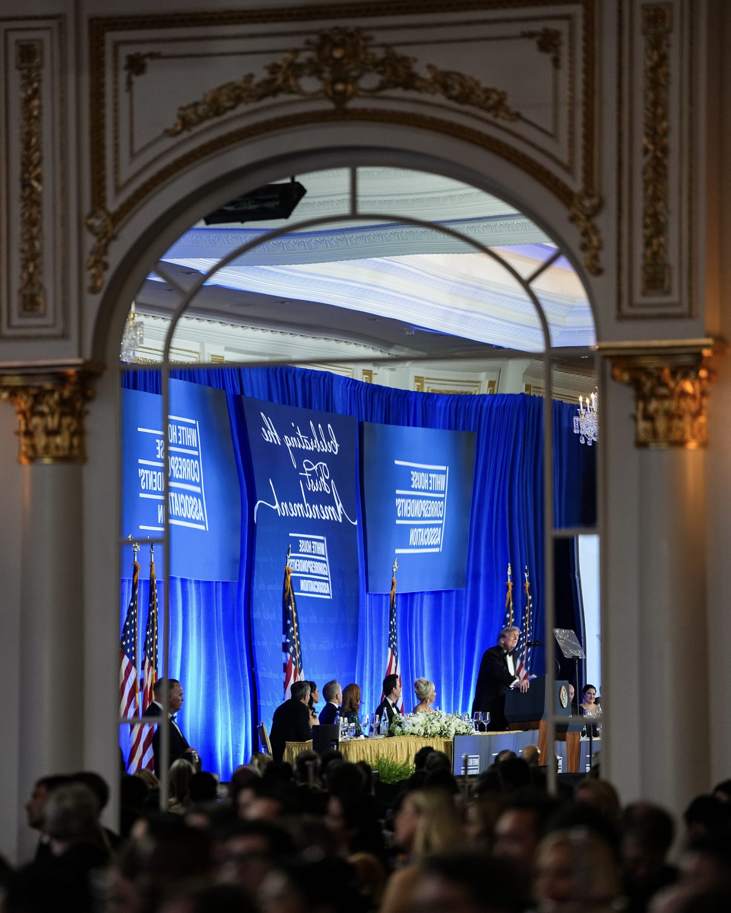 Donald Trump reflected in a mirror at the rescheduled White House Correspondents Dinner at the Waldorf Astoria in Washington