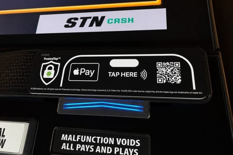 TrustedTap A-POD device mounted on bar-top slot machine at Station Casinos Las Vegas
